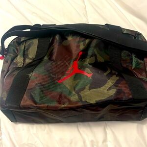 Jordan camo small duffle bag , never used, has handle, longer shoulder strap